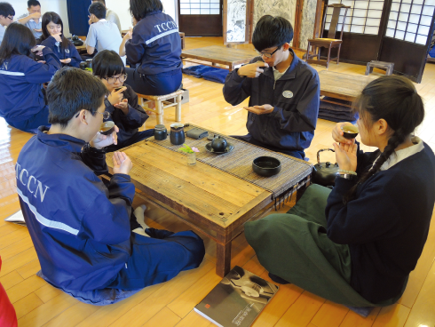  
    Students have tea together 